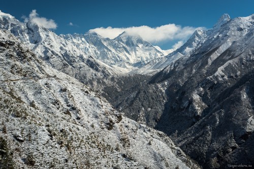 A stupa under snow (left) on the trail to Tengboche monastery (centre). Mt Everest (8850m) is making